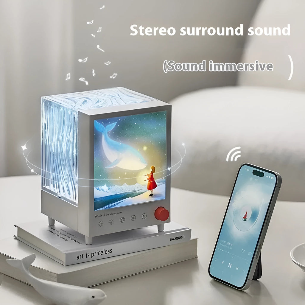 Aurora Treasure Box Star Sea Whale projection lamp with Bluetooth on a surface.