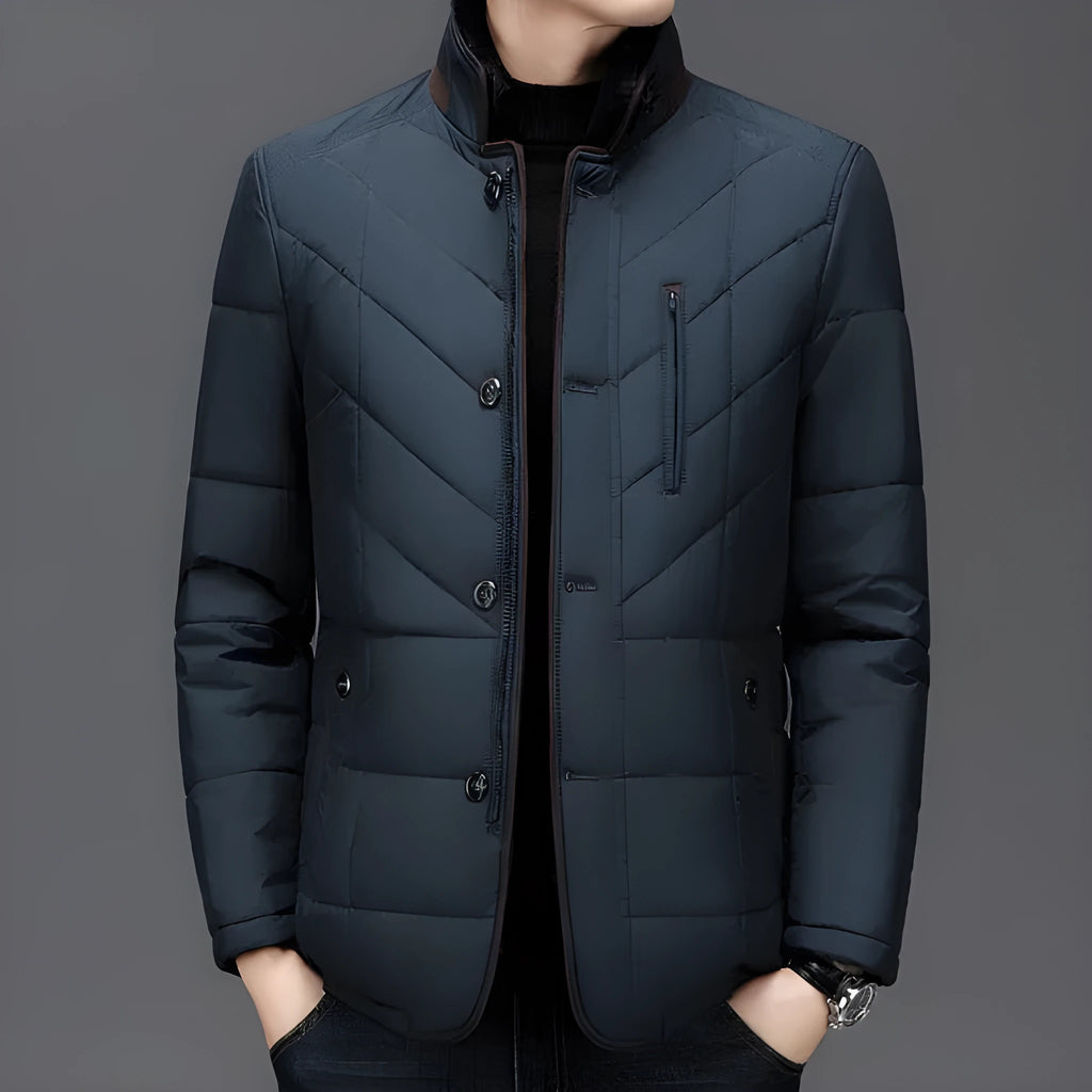 Men's dark blue padded winter short coat with side pockets on a neutral background.
