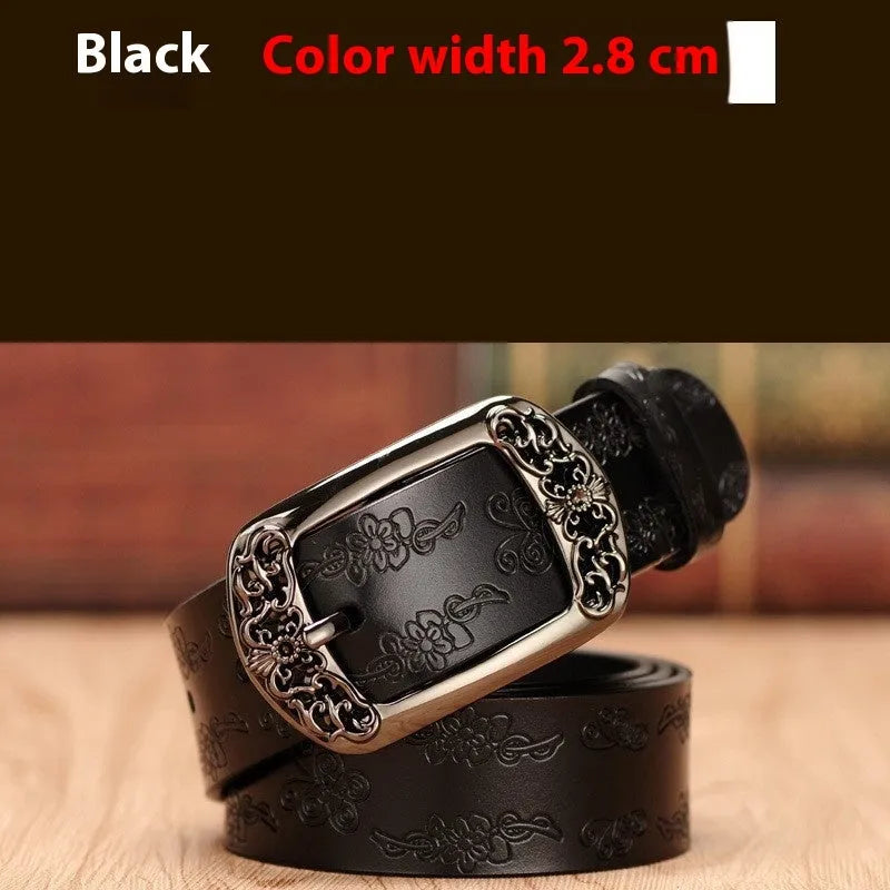 Thin black PU leather women's belt with an alloy buckle on a pair of jeans