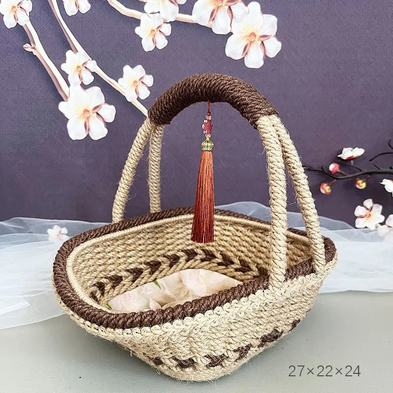 Hand-woven straw basket with hemp rope detail in coffee brown colour.