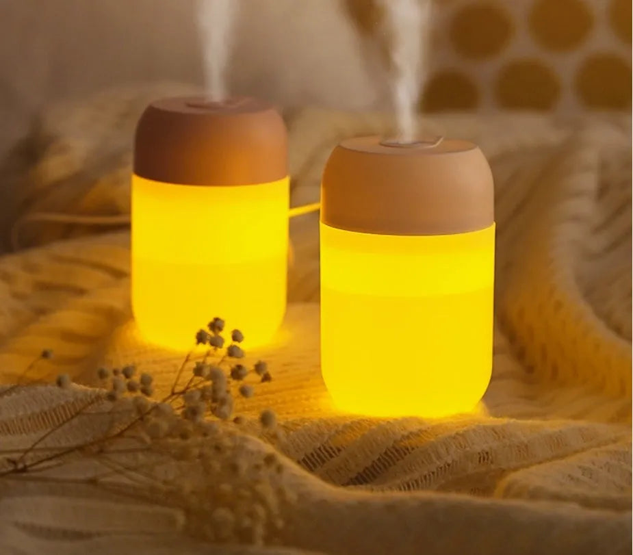 Small white cylindrical USB humidifier for desktop aromatherapy and humidification.