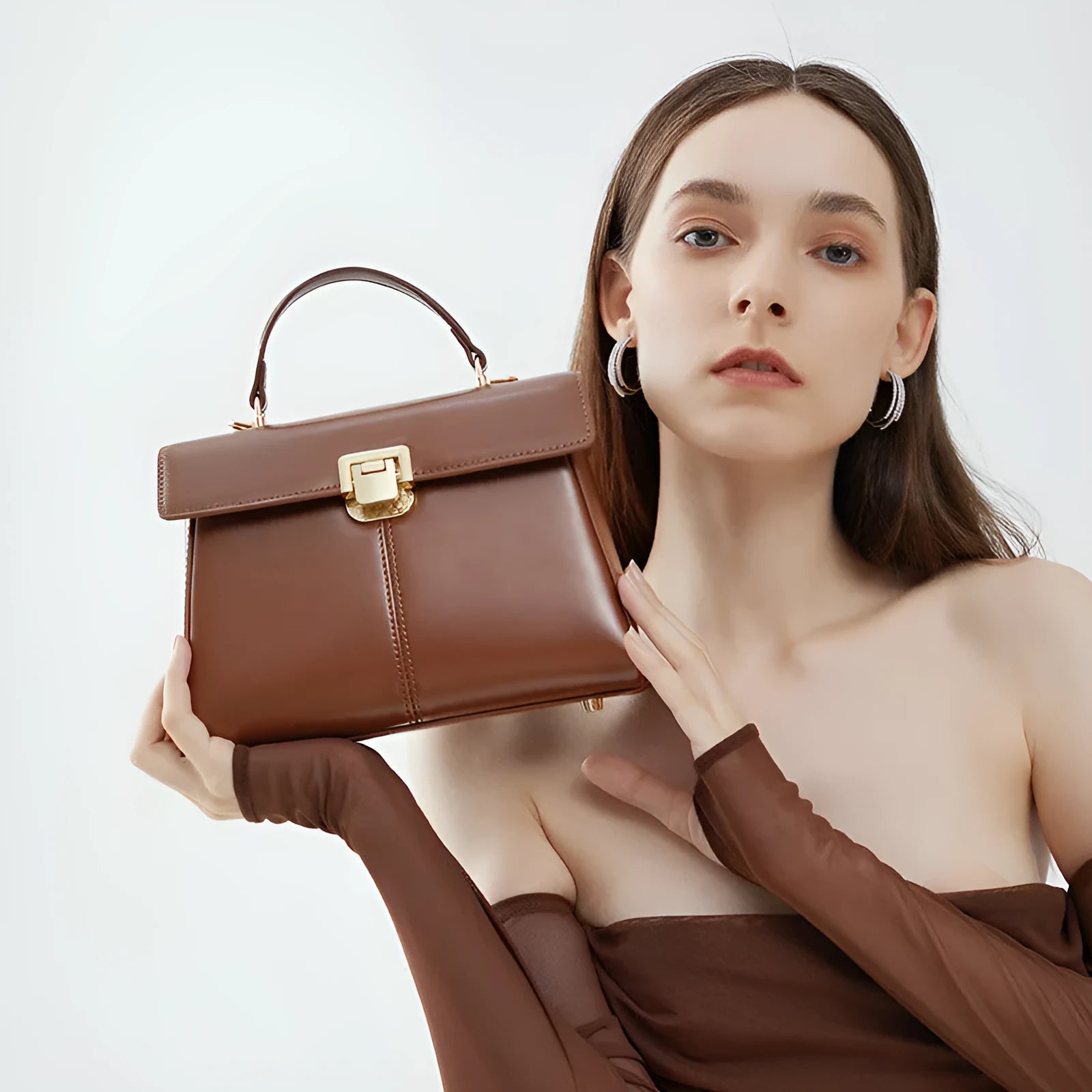 Black genuine leather women's shoulder bag with a front clasp, shown with a detailed view of the internal zip pocket.