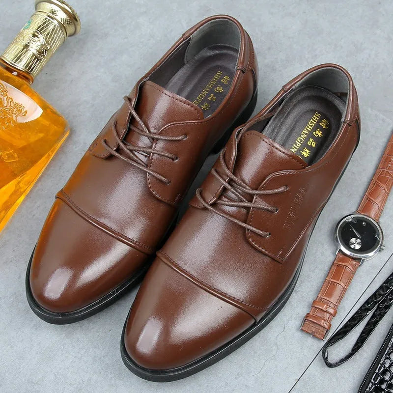 Men's black formal lace-up shoes with decorative stitching and horse buckle detail on rubber sole