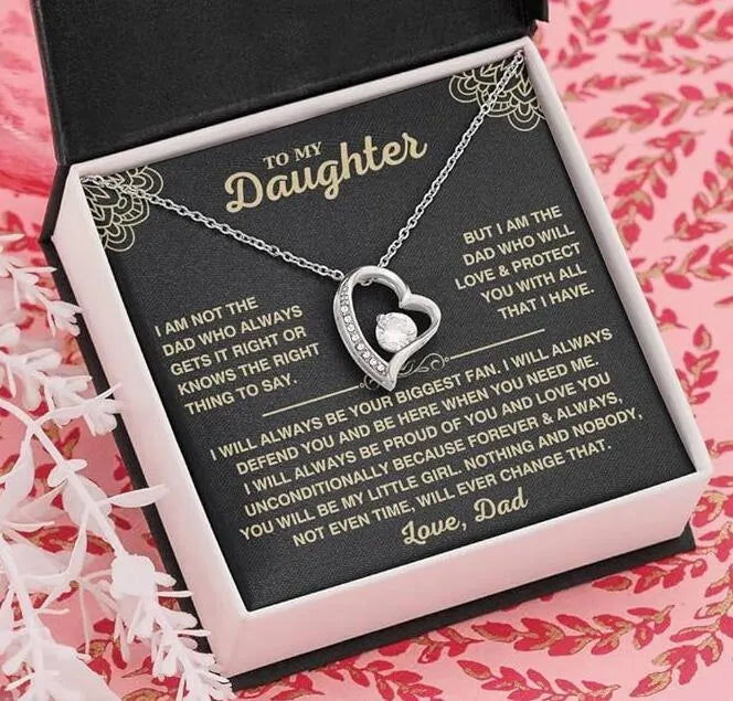 Hollow heart-shaped pendant necklace in silver or gold finish with gift box and card.