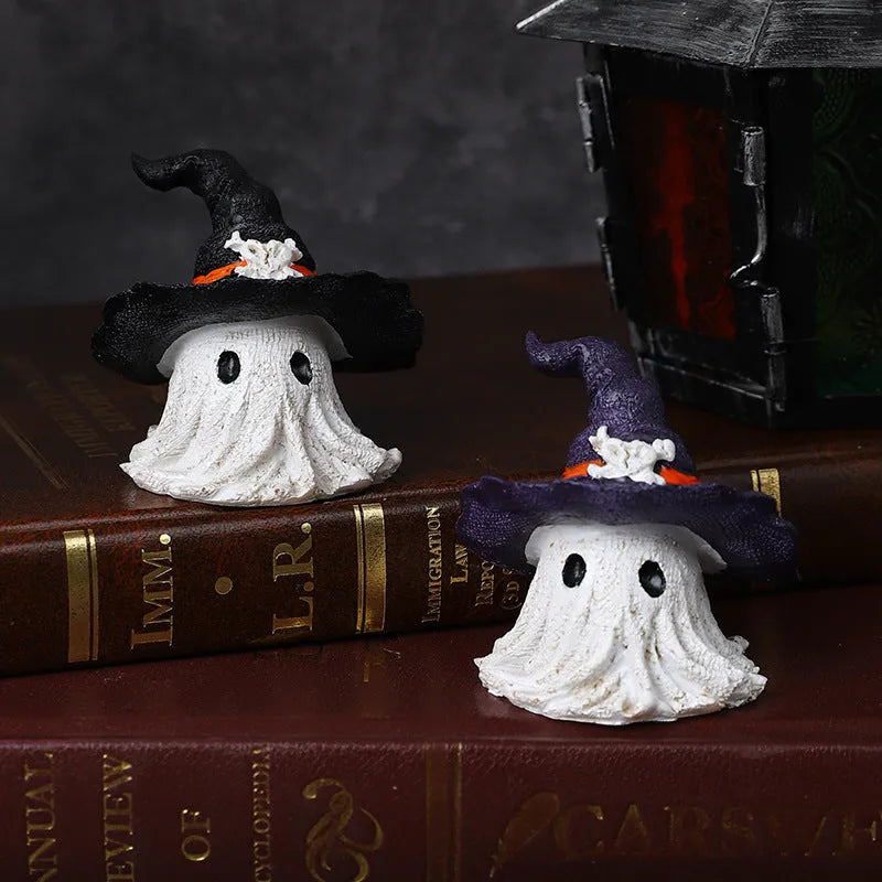Purple and black resin wizard hat and ghost holiday ornaments.