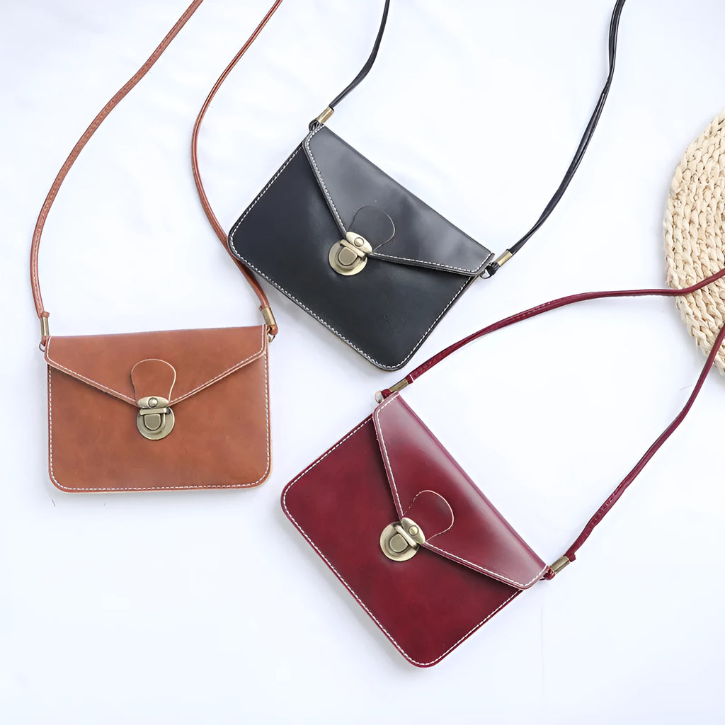 Soft retro cross square flap messenger bag in wine red, shown with lock detail and crossbody strap.