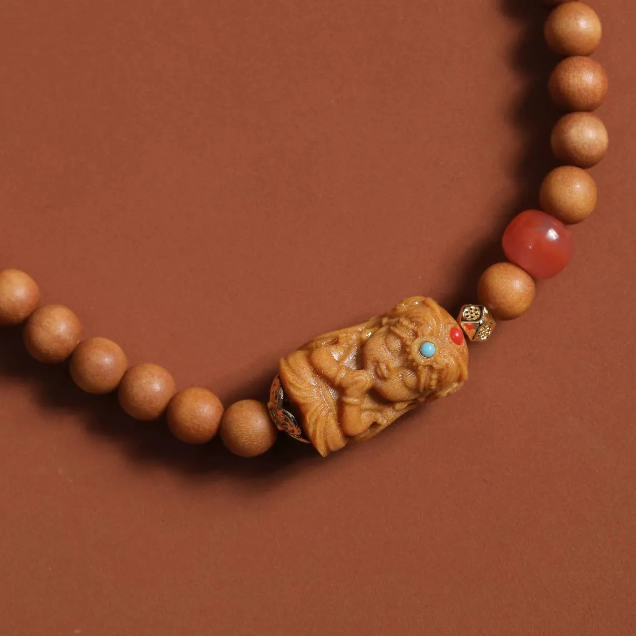 Brown woven wooden bracelet with 6mm round beads featuring South Red Zachilam and double circle design