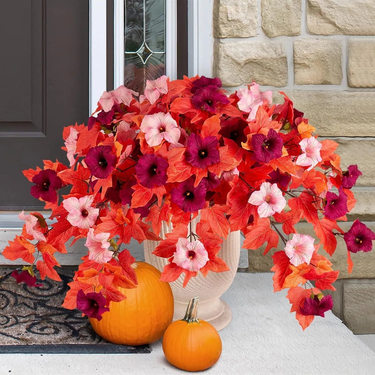 Purple plastic garden container with 12 forks holding red artificial silk flowers on a patio.
