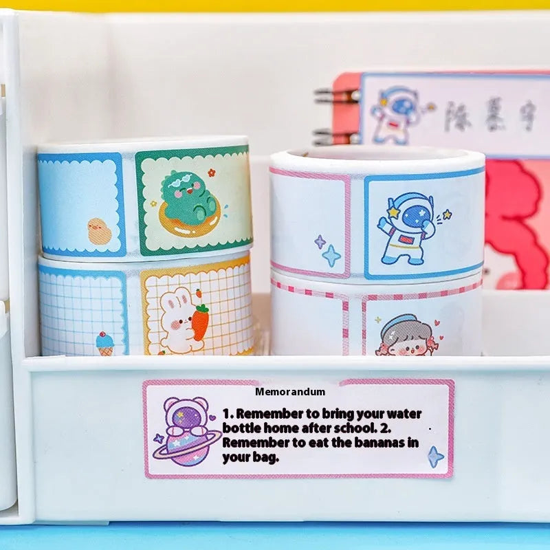 Roll of cartoon name tape stickers showing dinosaur, astronaut, rabbit and girl designs