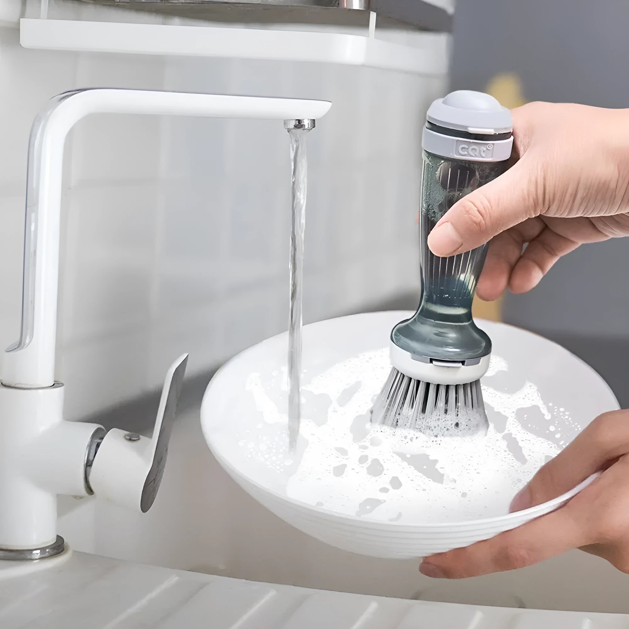 Milk white and mint green kitchen dish brush with soap dispenser and replaceable non-scratch head.