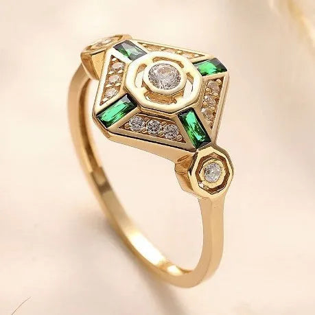 Ins style square emerald diamond ring in lvzuan colour on a white background.