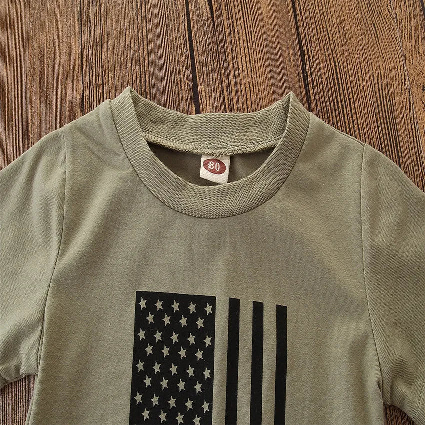 A little boy's camouflage print short sleeve shirt and pants summer suit set.