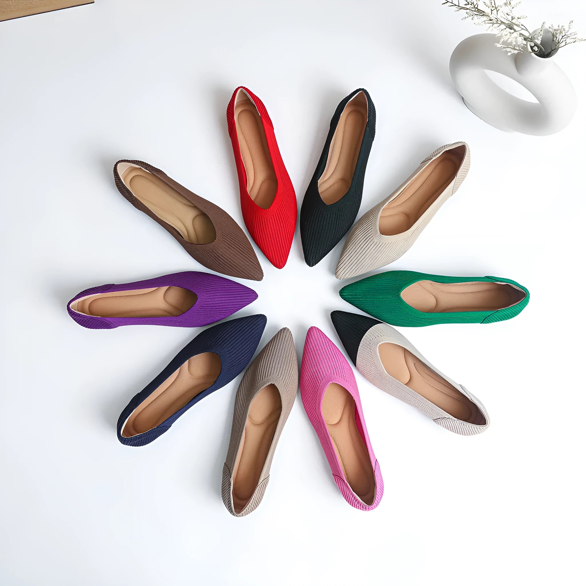 Women's apricot knit flat pumps with pointed toe and oversleeves design on a rubber sole.