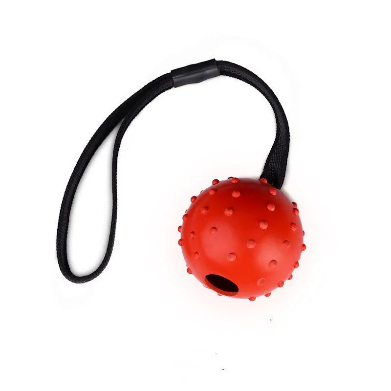 Dog training bite resistant rubber ball with rope in orange, size 6x30cm for medium dogs