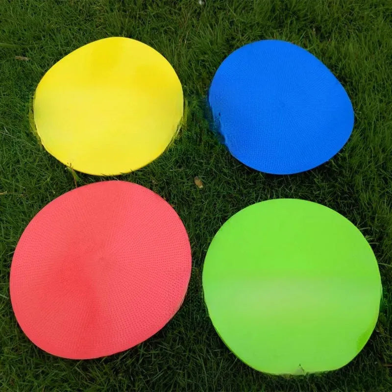 Yellow 23cm diameter flat TPE football training marker disc on grass