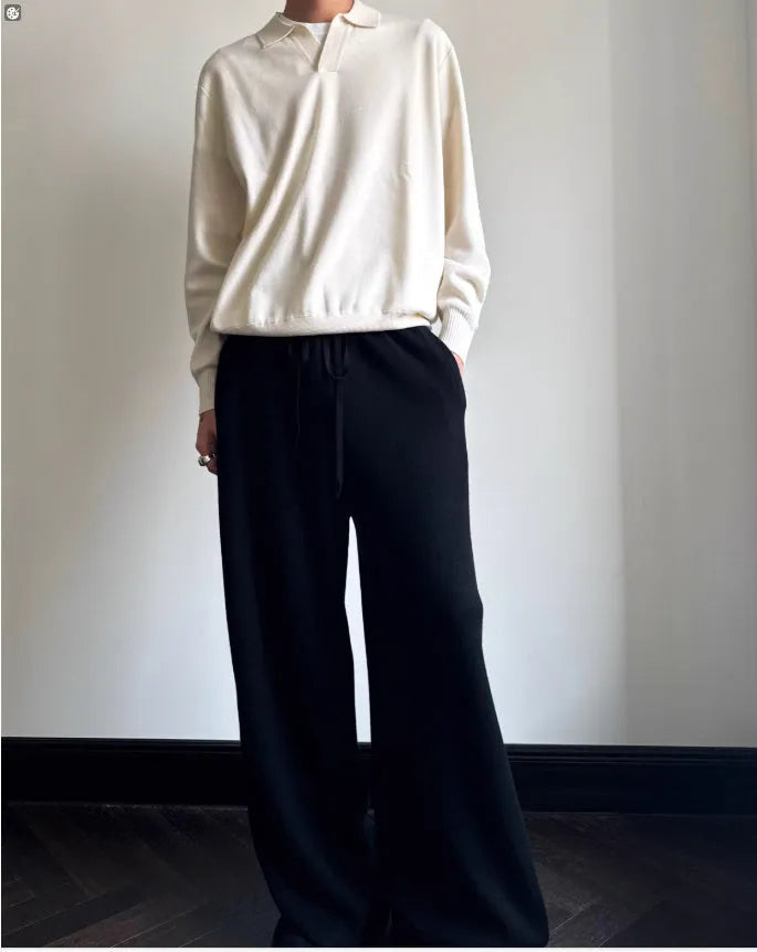 Man wearing a milky white pure wool polo sweater with a lapel collar and loose fit.