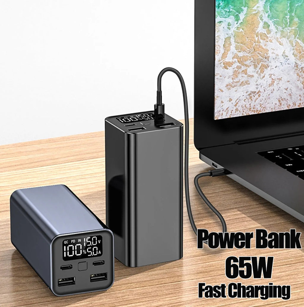 Black high-power 65W laptop charging bank with USB-C port, showing dimensions of 47.5x104.5x47.5mm.