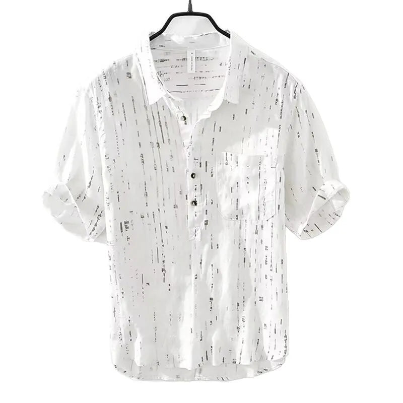 Mens loose-fit black polo shirt with a short sleeve and a V-neck lapel collar on a hanger.