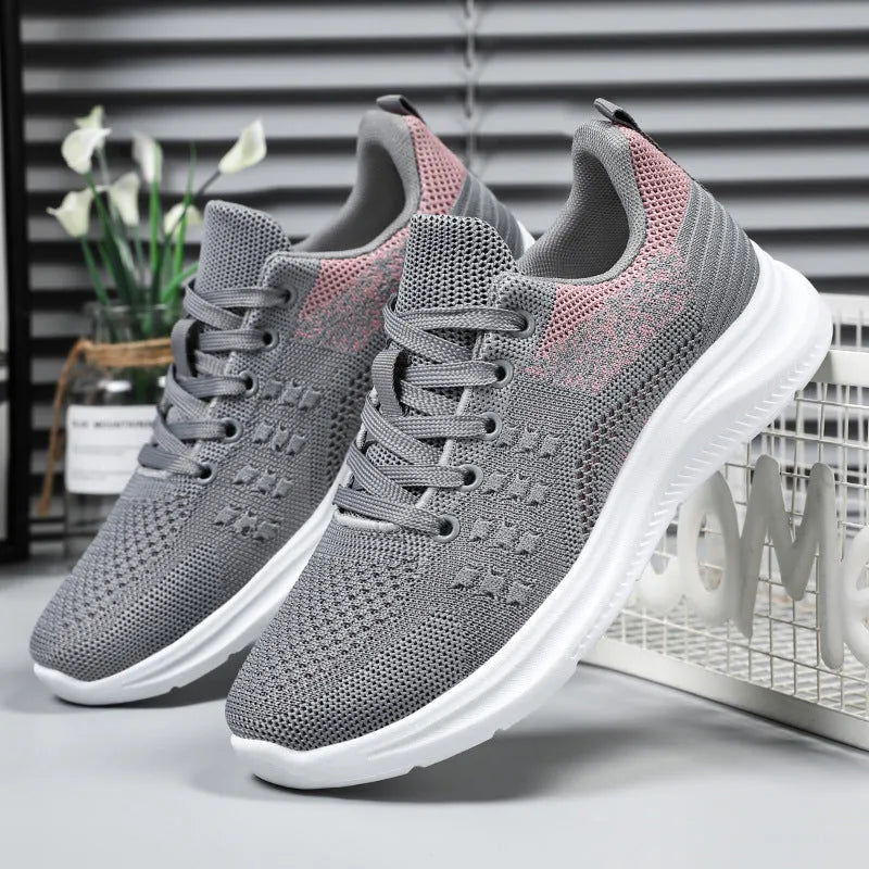 Women's black mesh sneakers with lace-up front and PVC soles
