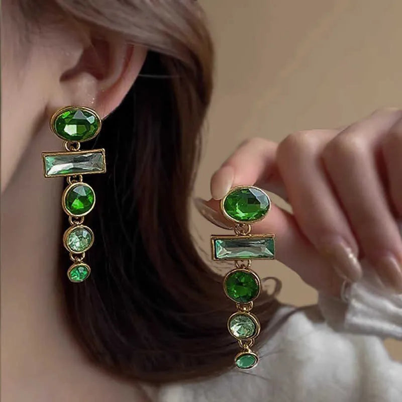 Pair of green gradient geometric alloy earrings with inlaid zircon stones and a dangling tassel.