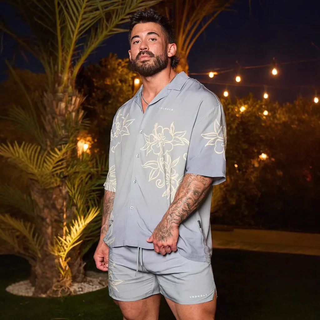 A man's loose-fitting, short-sleeve printed cardigan in a light colour for summer.
