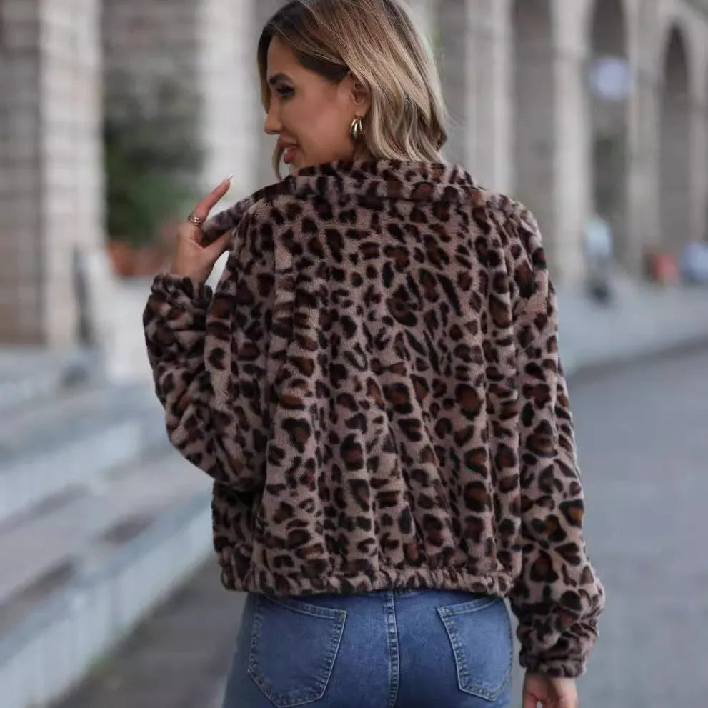 Women's loose long sleeve leopard print zip coat with raglan sleeves on a hanger.