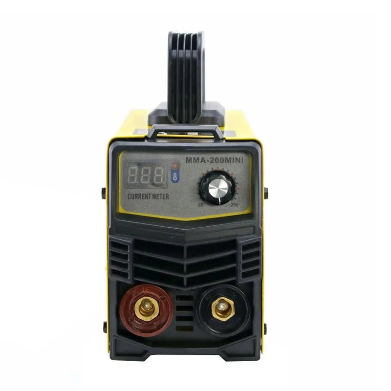 MMA-200MIN compact inverter DC welding machine with welding tongs, grounding clamp, and face shield on a workbench.