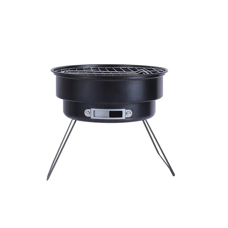 Small round folding metal ice stove with grill and foldable legs packed in a carry bag.