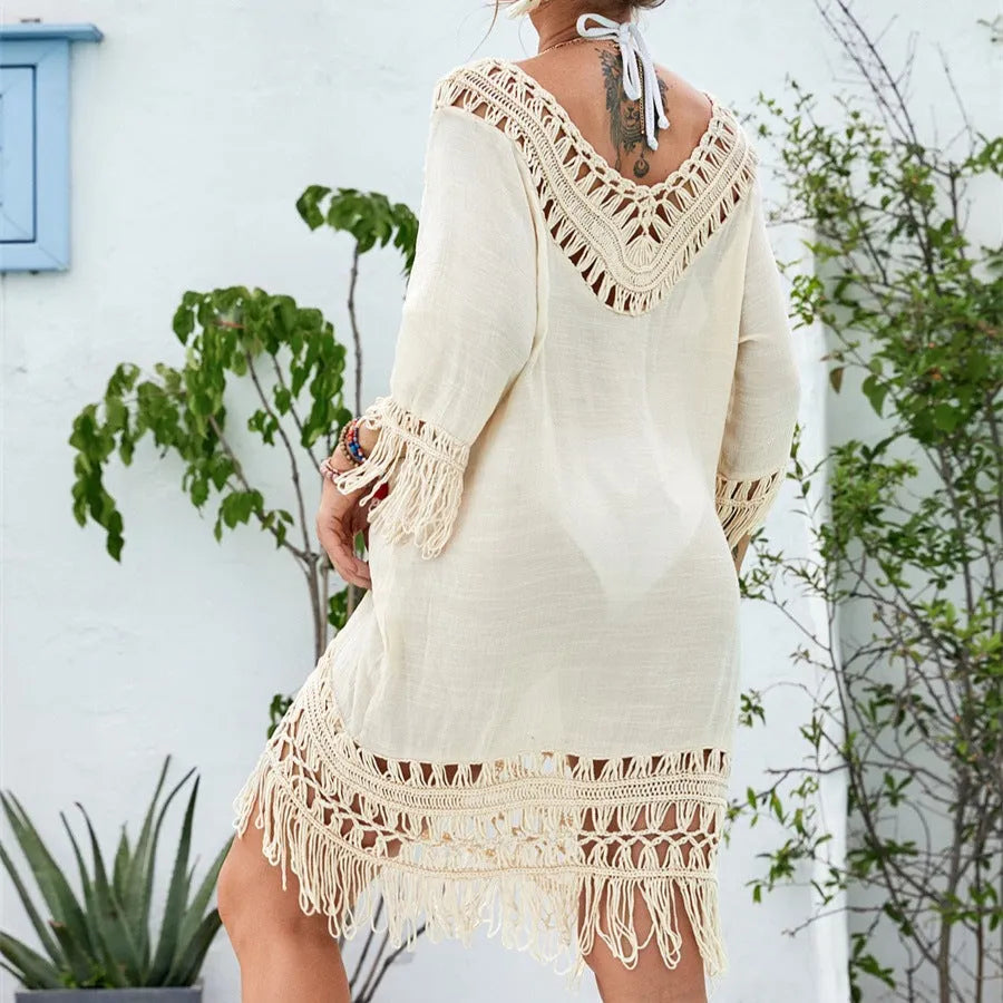 Apricot coloured crocheted patchwork women's dress with half sleeves and a mid-length skirt.