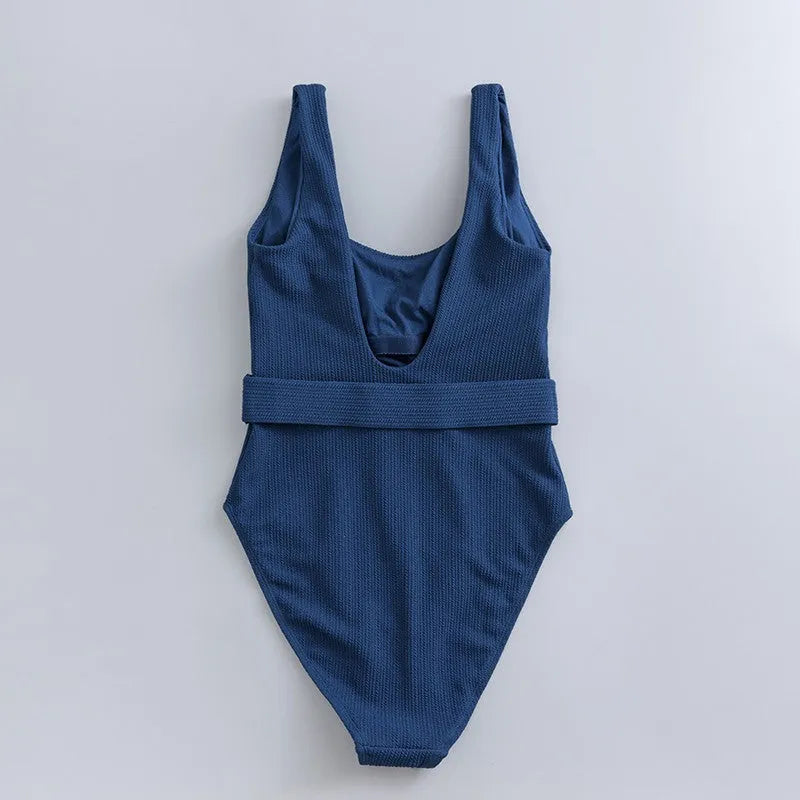 Navy blue women's one-piece swimsuit with triangle neckline, slim fit, and sleeveless design.