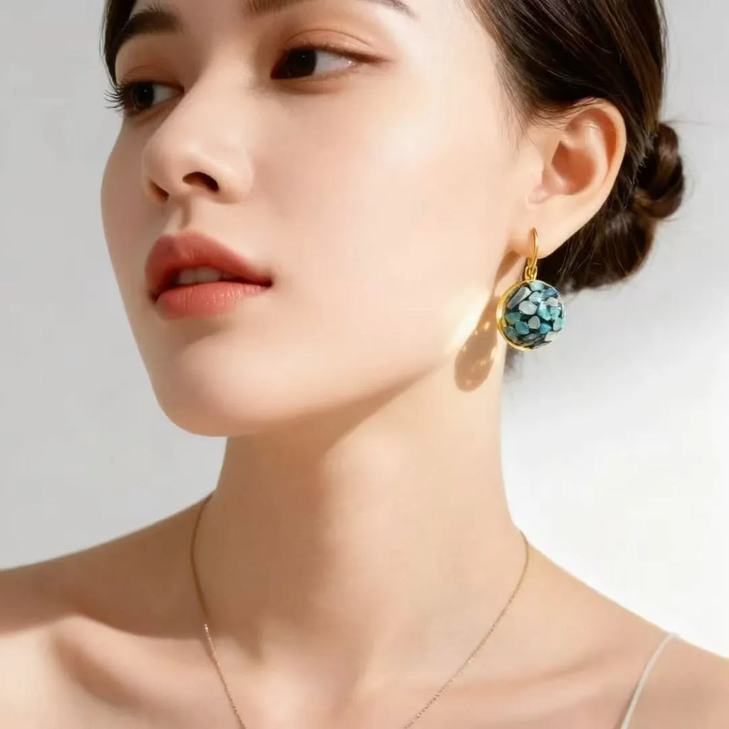 Handmade mother-of-pearl snail ear clip with Chinese character Fu