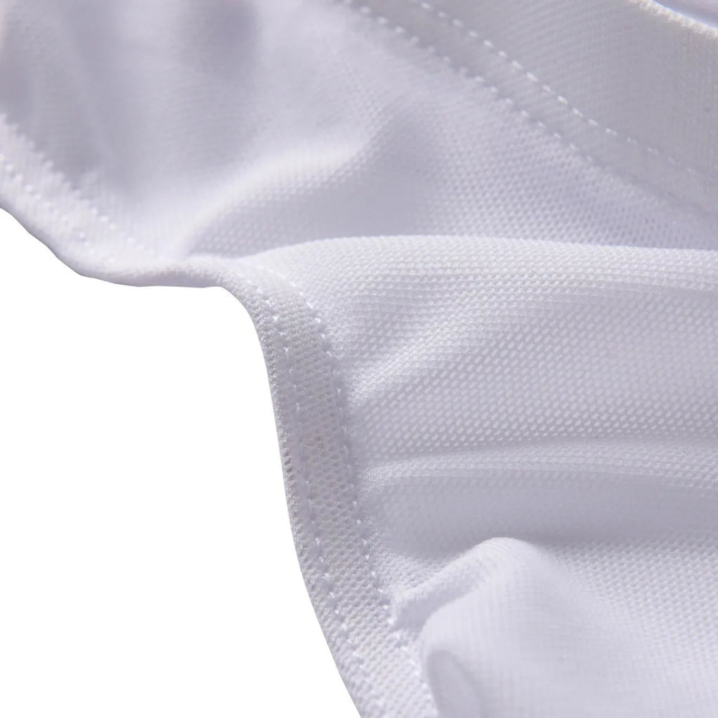 Man's black ice silk nylon mid-waist briefs laid flat, showing triangle cut and knit texture.