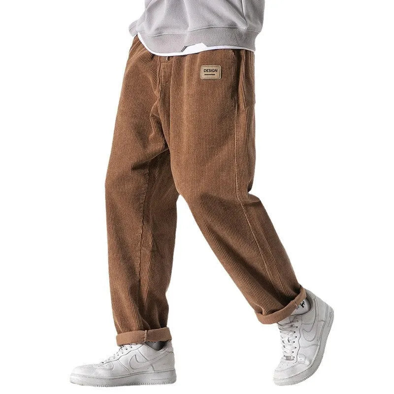 Men's loose straight corduroy sports trousers in Army Green colour showing mid-waist and full length design