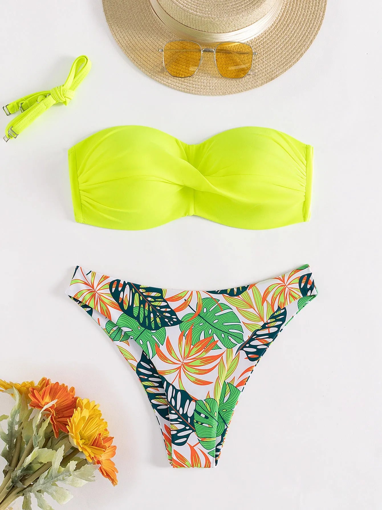 Green hard cup push up bikini swimsuit set with briefs bottom on a mannequin.