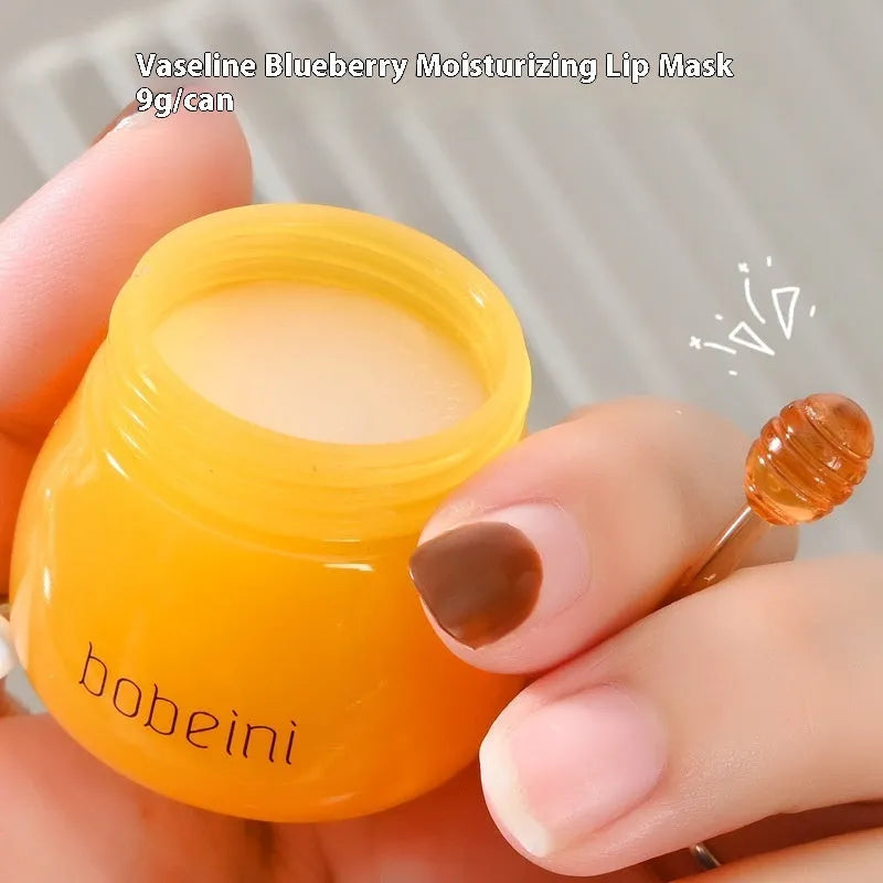 Vaseline lip balm pot 9g with small brush applicator in blueberry or pomegranate flavour