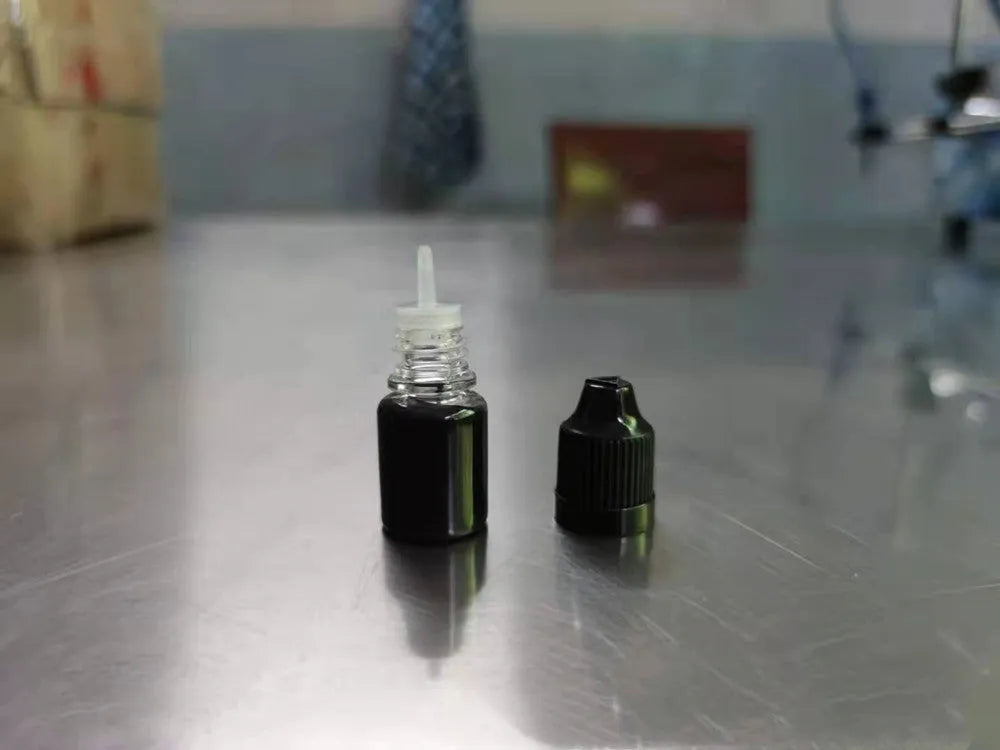 A 5ml bottle of black quick-dry confidentiality seal ink for office stamp seals.