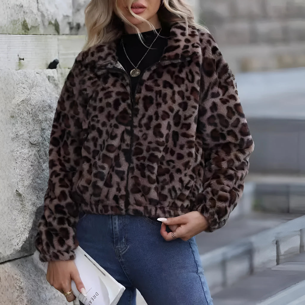 Women's loose long sleeve leopard print zip coat with raglan sleeves on a hanger.