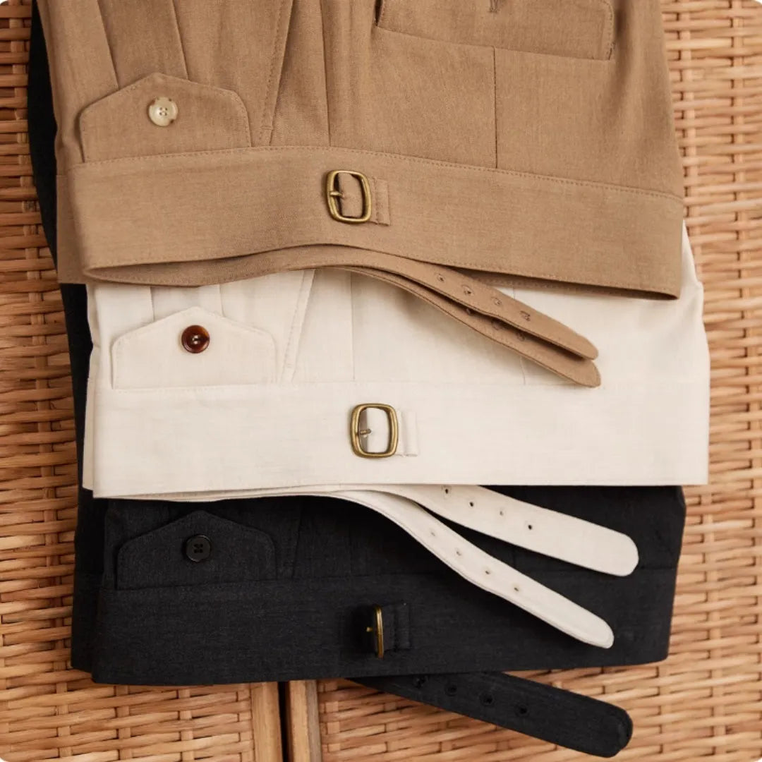 Man wearing slim fit wrinkle resistant business casual trousers in a light brown colour.