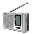 Portable silver grey FM AM radio on table, compact ABS body with built-in speaker and dial controls
