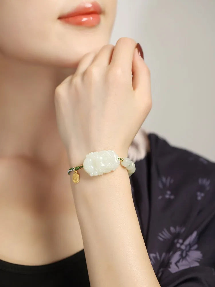 Hetian jade and S925 silver Chinese zodiac bracelet on a red rope for the Year of the Rabbit