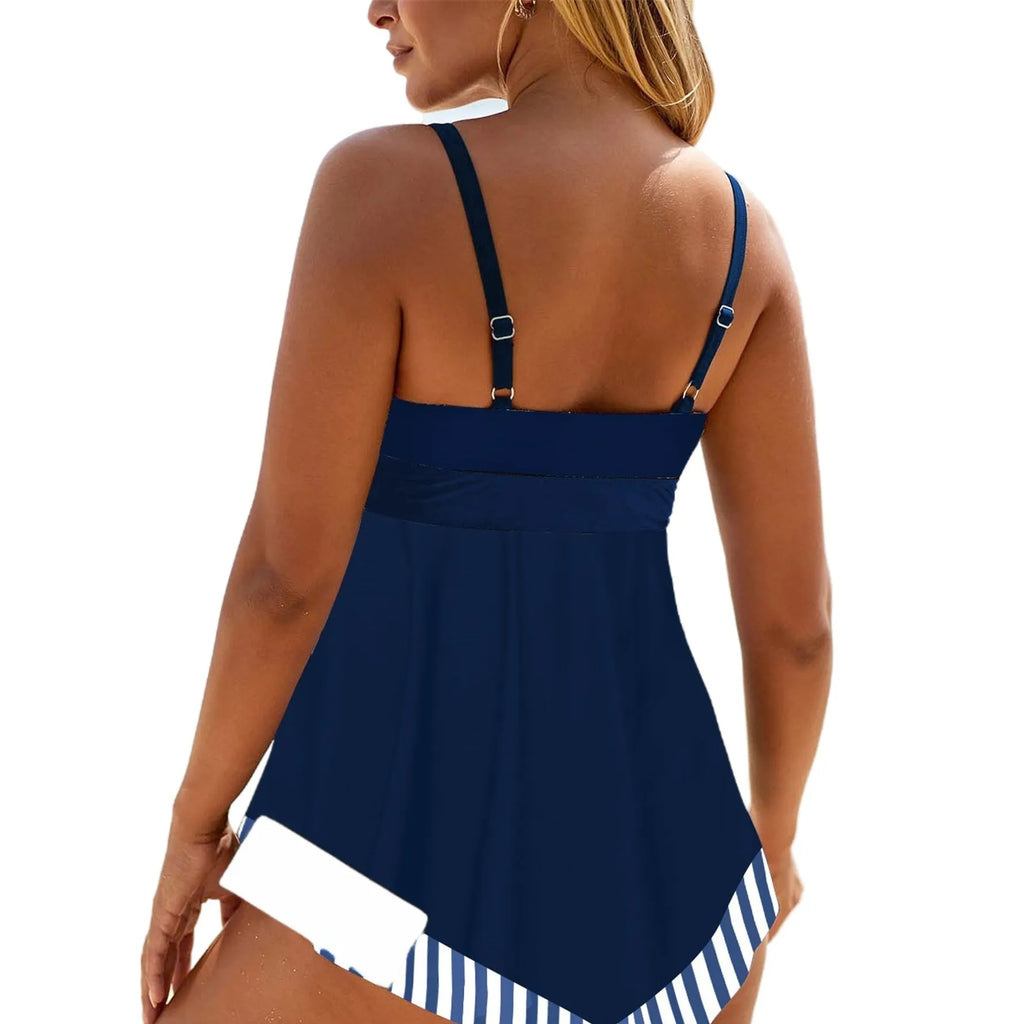 Plus size woman in a blue two-piece bikini swimsuit with a backless top and briefs bottom.