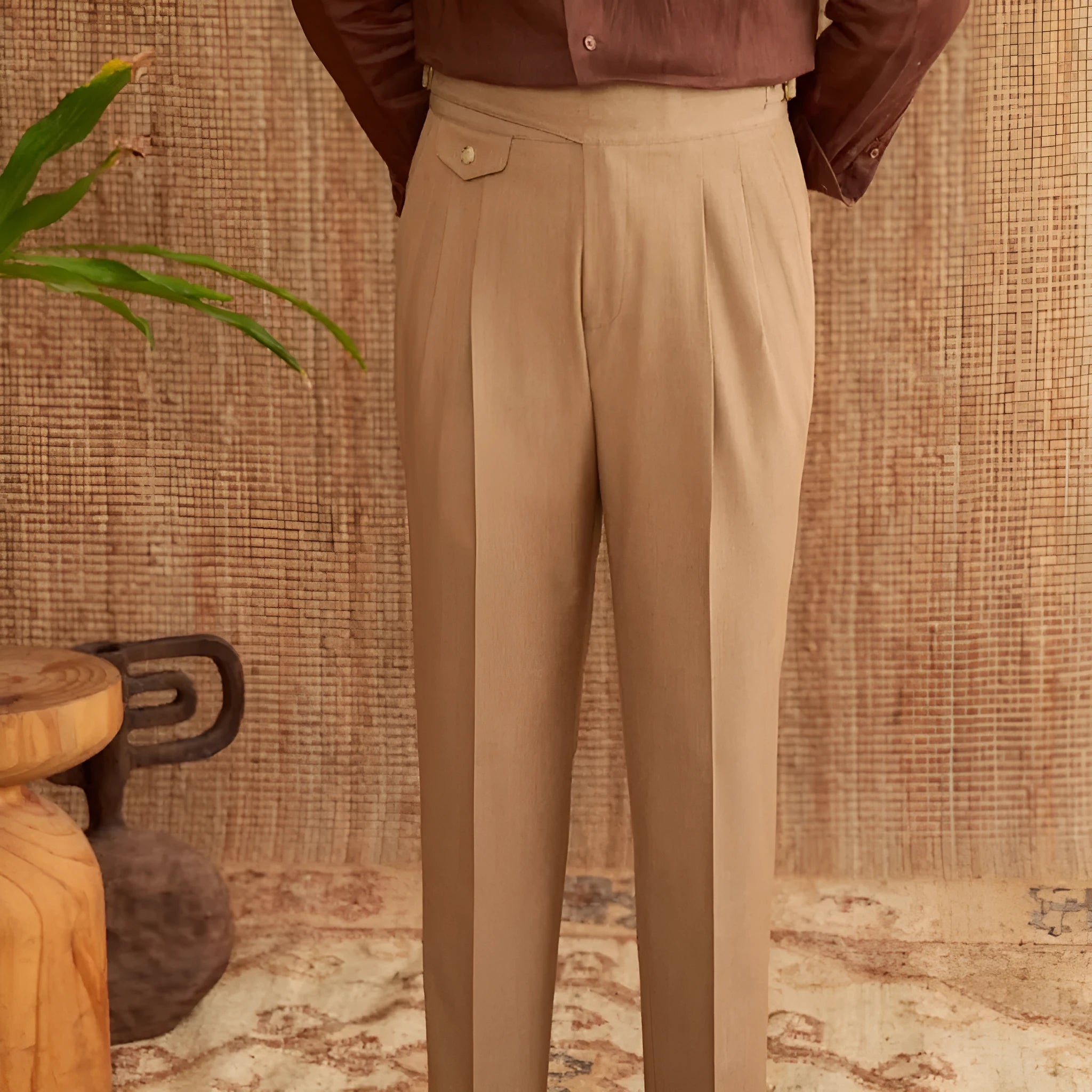 Man wearing slim fit wrinkle resistant business casual trousers in a light brown colour.
