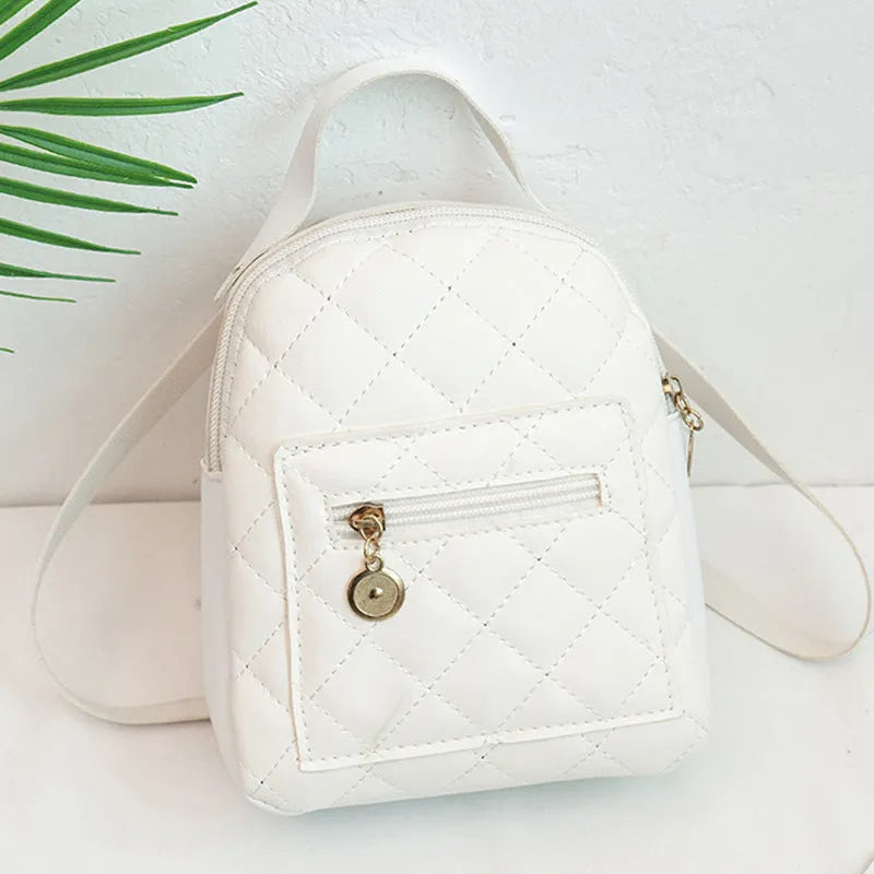 Hard square girls backpack with embroidered floral design in pink colour.