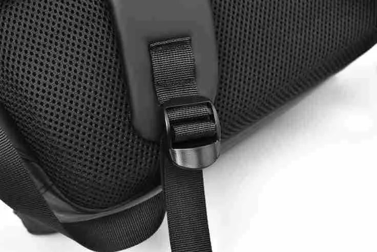 Men's large waterproof PU leather backpack in grey colour with visible stitching and laptop compartment.