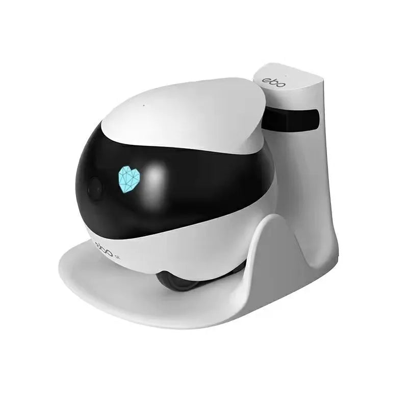 White smart home mobile robot camera on a charging dock.