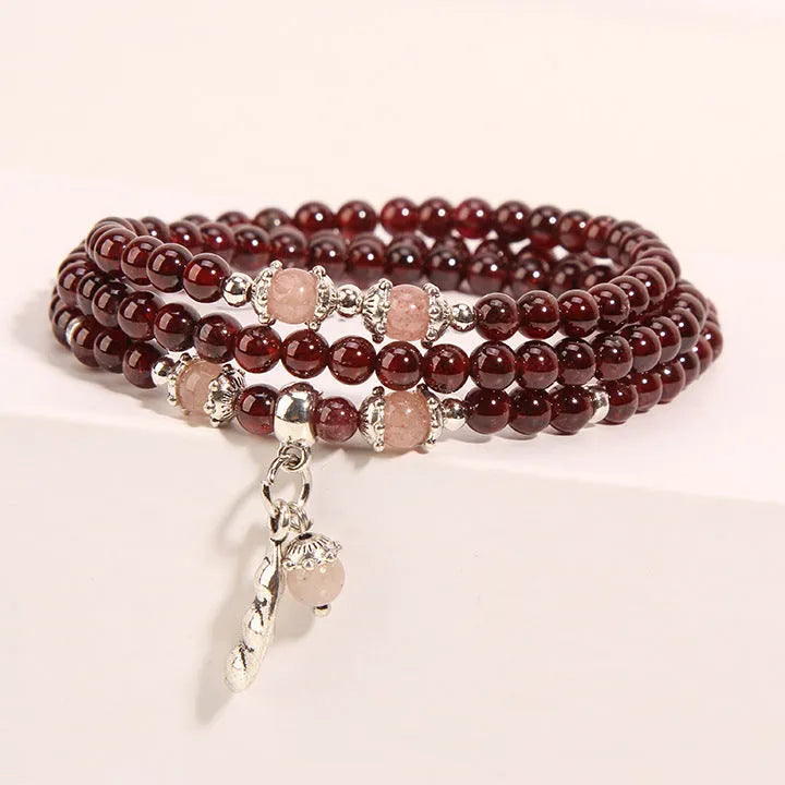 Women's floral crystal bracelet in sauteed green beans and wine red garnet colour with Bohemian and ethnic style.