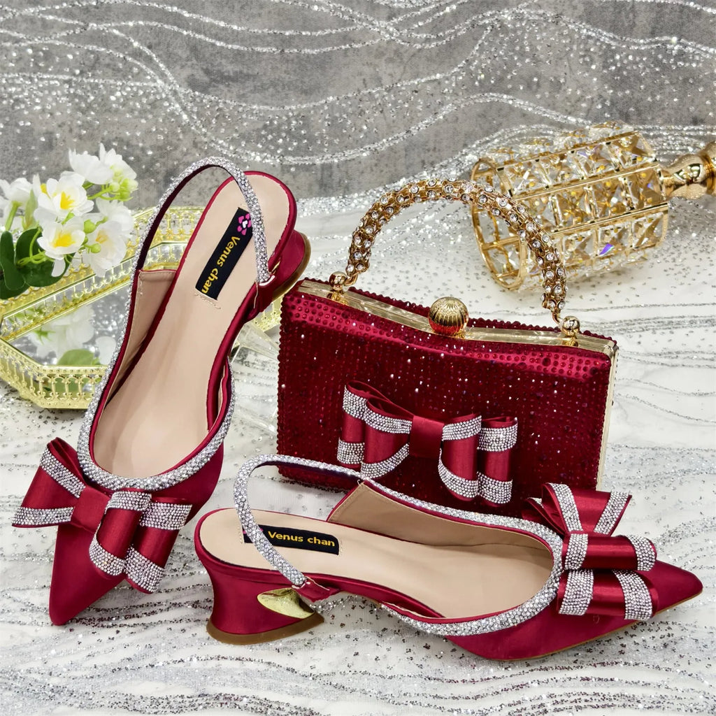Women's pointed toe mid-heel sandals with square buckle and matching rhinestone bag in multiple colours.