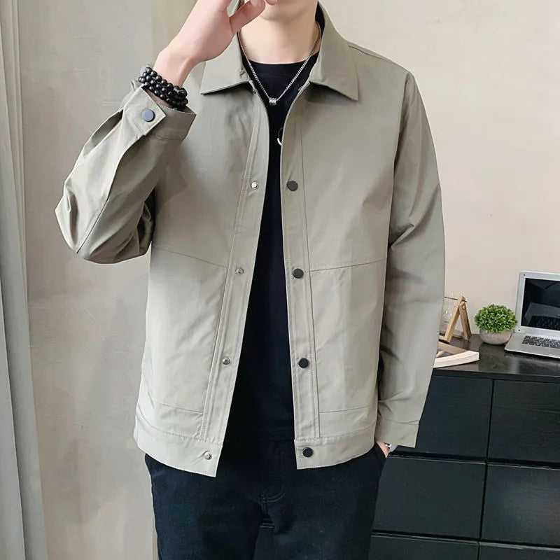 Man wearing a thin, single-layer Korean style jacket in light gray for spring or autumn.