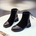Black women's knee-high Martin boots with a side zip and decorative bow.