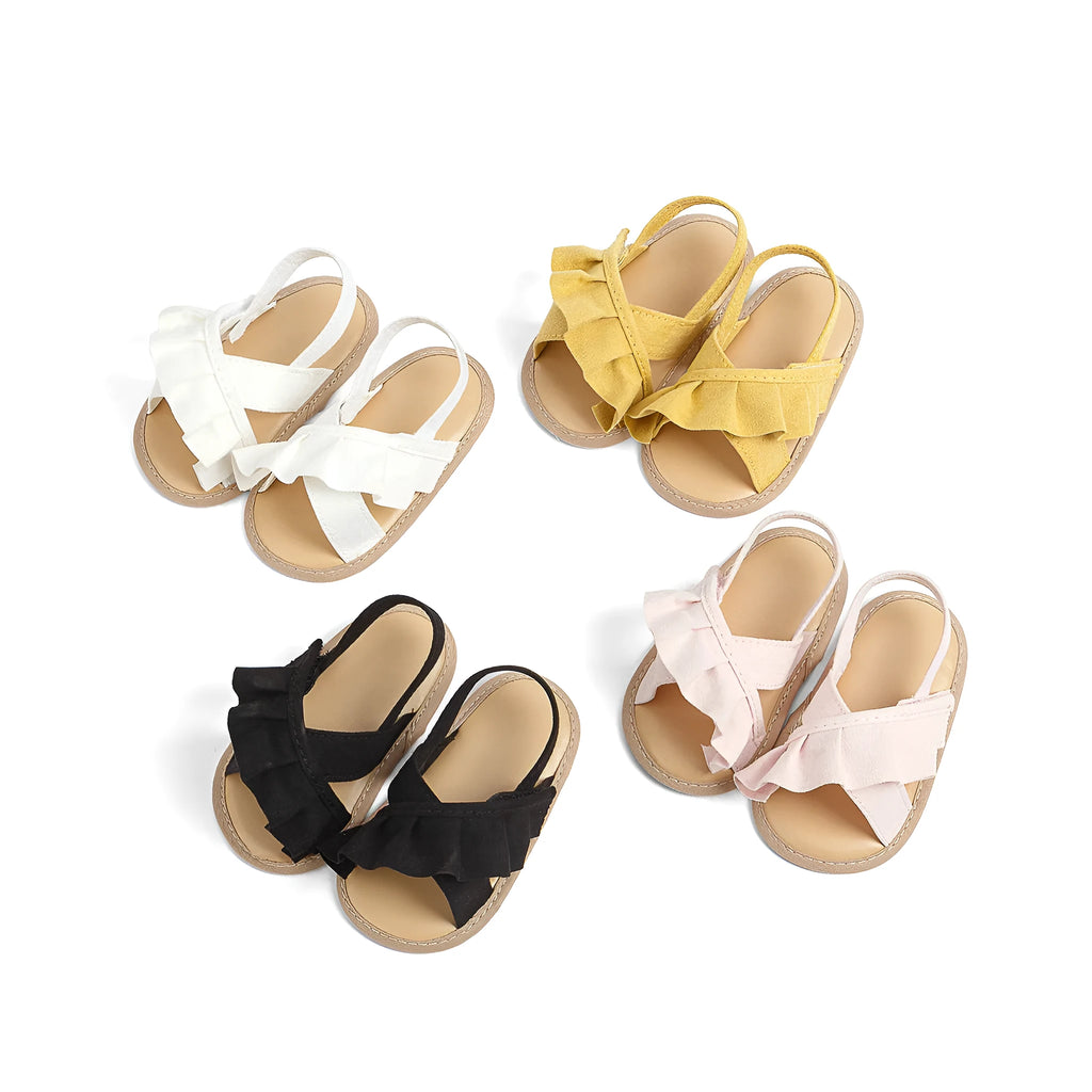 Baby girl toddler shoes with soft bottom, lace, and Velcro closure in white cotton cloth, side view
